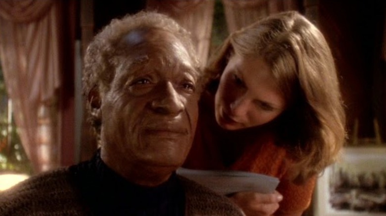 Old Jake Sisko looking forlorn as Melanie talks in his ear on Star Trek: Deep Space Nine