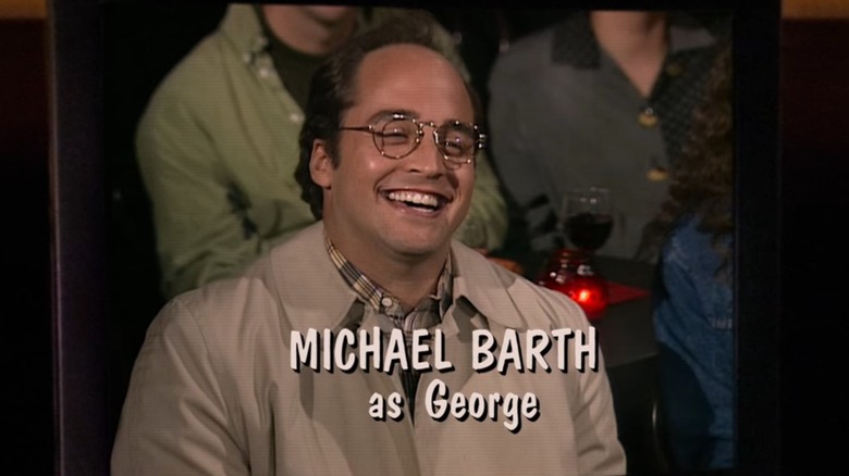 Jeremy Piven's Michael Barth, in character as George, laughs while a title screen displays his credit and character name in Seinfeld