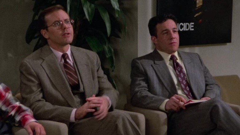 Kevin Page's Stu and Peter Blood's Jay sit in chairs in an NBC office in Seinfeld