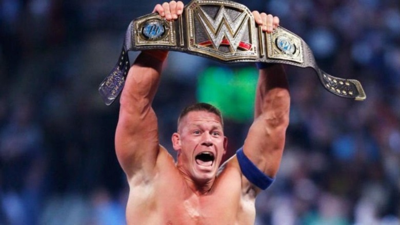John Cena holding the World Heavyweight Championship Belt