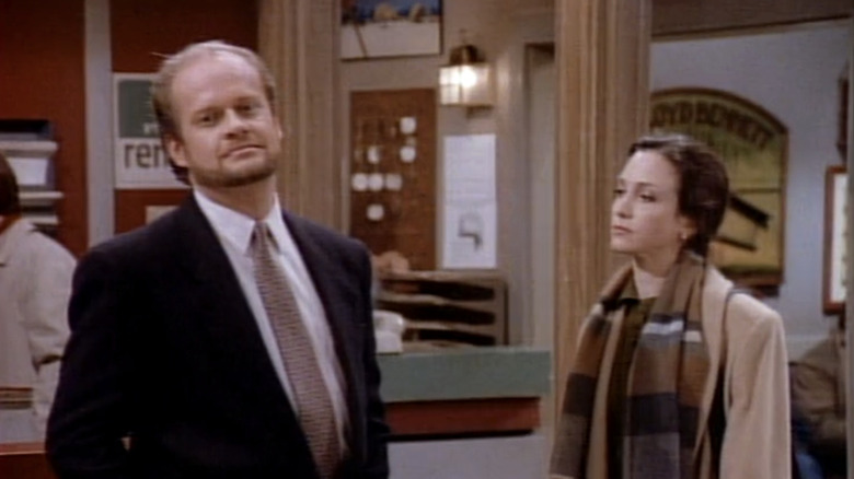 Kelsey Grammer's Frasier Crane and Bebe Neuwirth's Lilith Sternin stand side by side in Wings