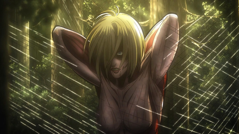 A female Titan caught in a trap in Attack on Titan