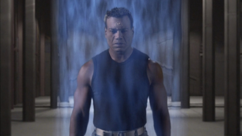 Teal'c of Christopher referee is surrounded by an energy field in Stargat SG-1