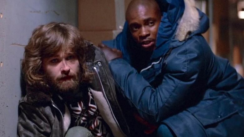 MacReady and Childs huddled together in The Thing