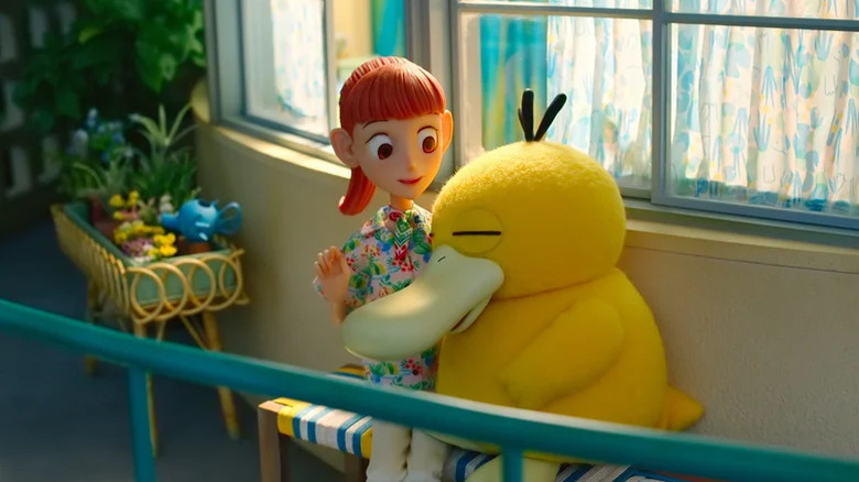 Psyduck cuddles with Haru in Pokémon Concierge