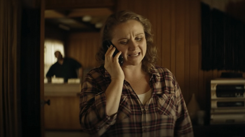 Danielle Macdonald on the phone in The Tourist