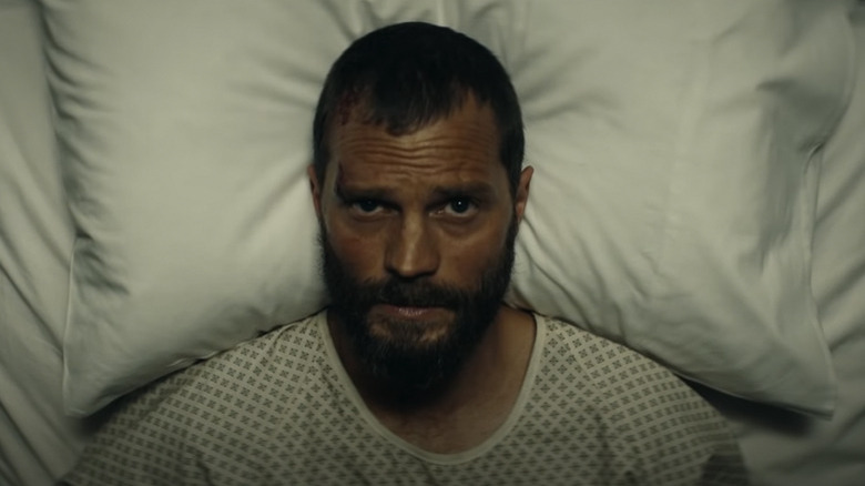 Jamie Dornan in a hospital bed in The Tourist