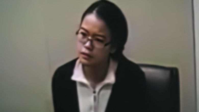 Jennifer Pan being interrogated in fuzzy police footage