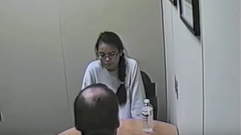 Grainy interrogation footage of Jennifer Pan