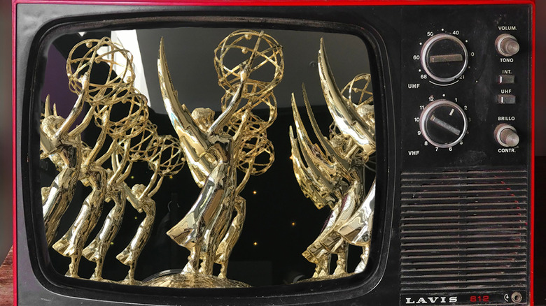 A series of Emmys trophies pictures on a vintage television set