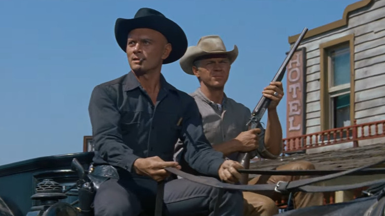 Yul Brynner and Steve McQueen ride through town