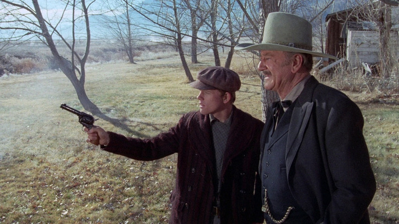 Old John Wayne teaches Ron Howard in The Shootist