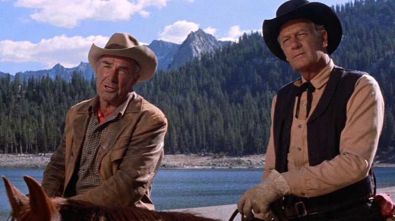 Steve Judd and Gil Westrum riding horses in a mountain range in Ride the High Country