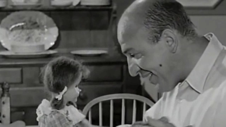 Erich (Telly Savalas) faces Talking Tina in The Twilight Zone (1959)