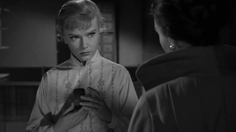 Marsha (Anne Francis) holds a thimble in The Twilight Zone (1959)