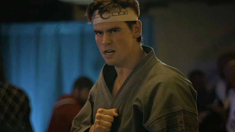 Axel Kovacevic on Patrick Luvis in Cobra Kai's combat stance