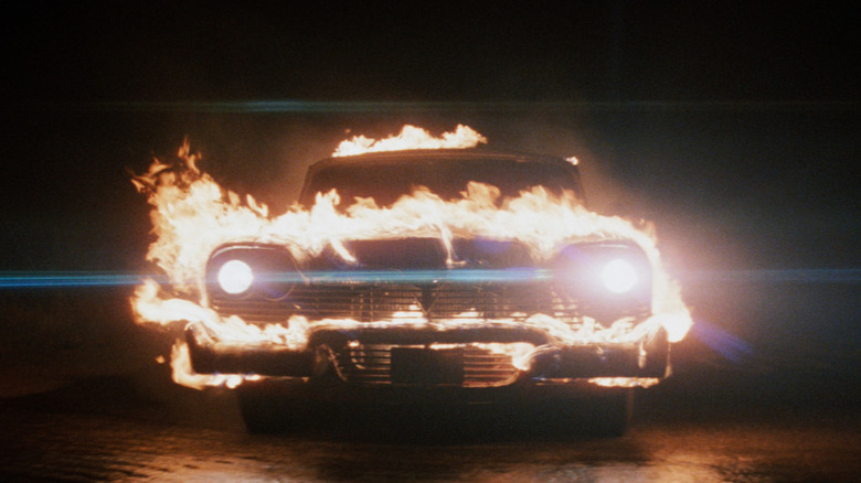 The car Christine in Christine, engulfed in flames