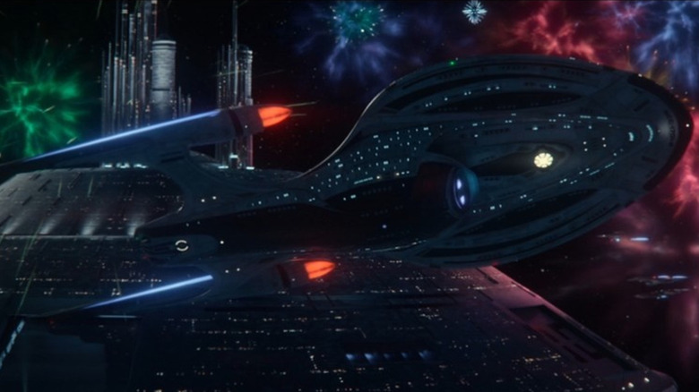 The Enterprise-F, against a sky full of fireworks in Star Trek: Picard.