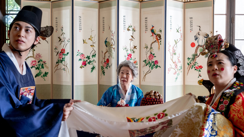 Min, grandmother, and Angela are confused about tradition in The Wedding Banquet