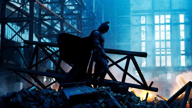 Batman walking among wreckage in The Dark Knight