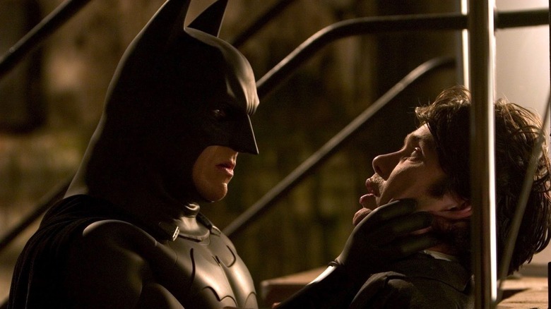 Batman grabbing Jonathan Crane in Batman Begins