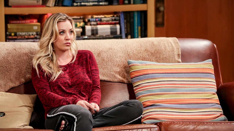 Penny sitting on the couch looking annoyed on The Big Bang Theory