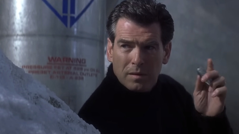 Pierce Brosnan's James Bond holds a remote detonator in Die Another Day