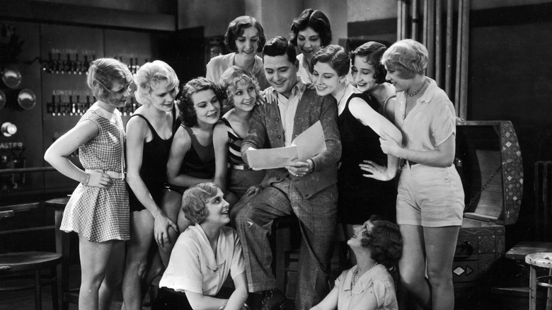 A group of actors gathered together in The Broadway Melody