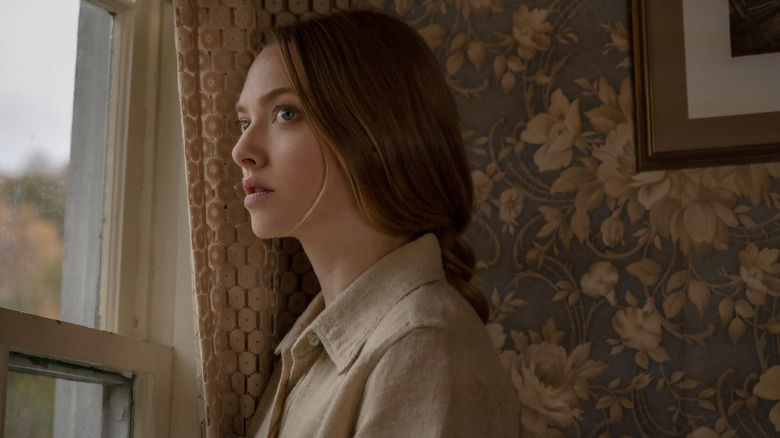 Amanda Seyfried as Catherine staring out a window in Things Heard & Seen