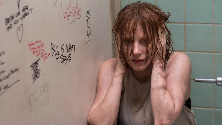 Beverly crouched in a bathroom stall in "It: Chapter Two"