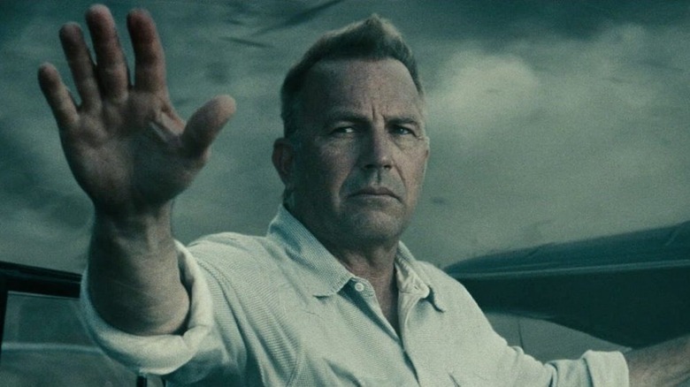 Jonathan Kent raising his arm in Man of Steel