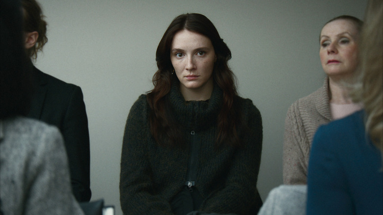 Kelly-Anne (Juliette Gariépy) sits in a courtroom in Red Rooms