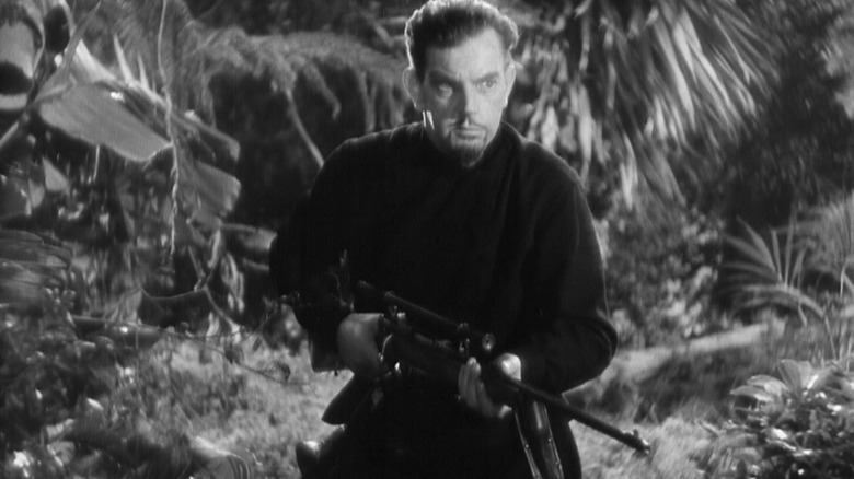 Count Zaroff running through the woods with a rifle in "The Most Dangerous Game."