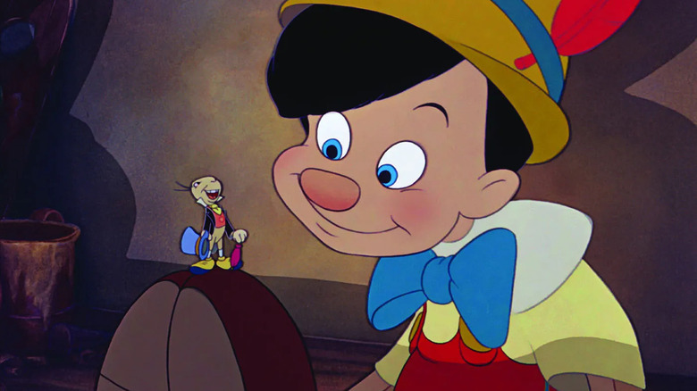 Pinocchio listening to Jiminy Cricket in Pinocchio