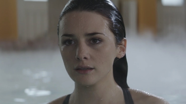 The price of Lucinda on Addison Timlin looks through the frame while in the pool in the fallen