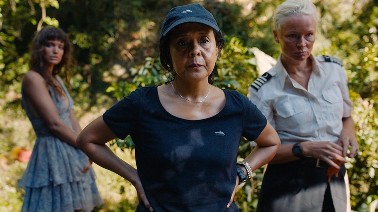 Abigail, flanked by Yaya and Paula, stranded on an island in Triangle of Sadness