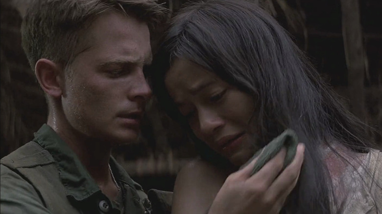 Michael J. Fox as Eriksson and Thuy Thu Le as Oanh in Casualties of War