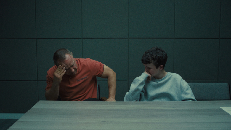 Eddie Miller sits stalled and his son Jimmy in an interrogation room in adolescence