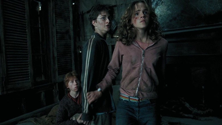 Hermione shielding Harry and Ron in Harry Potter and the Prisoner of Azkaban