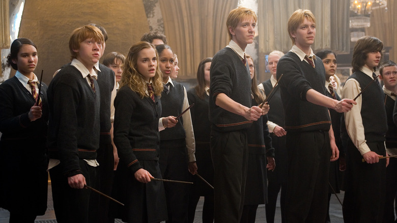 Ron, Hermione, Fred, and George practicing Defense Against the Dark Arts in Harry Potter and the Order of the Phoenix