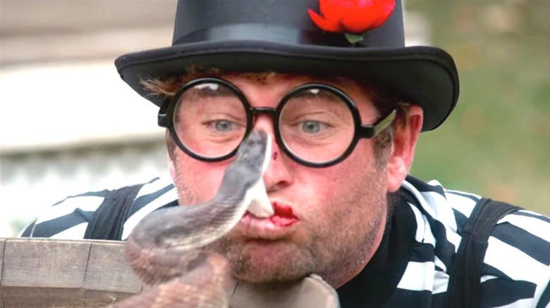 Sean "Poopies" McInerney kisses a snake in Jackass Forever (2022)