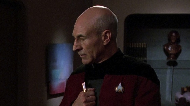 Picard holding Kamin's flute.