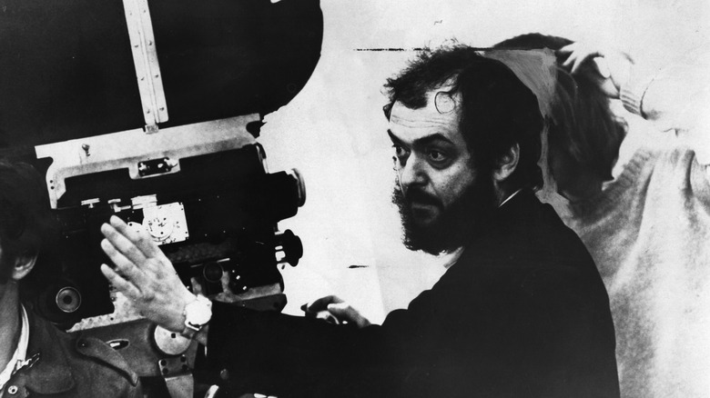 Stanley Kubrick looking through a camera 