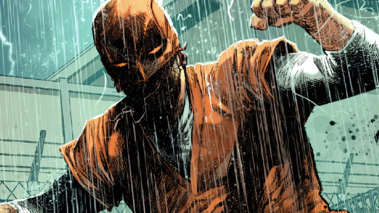 Daredevil in prison uniform on rainy night in Marvel Comics