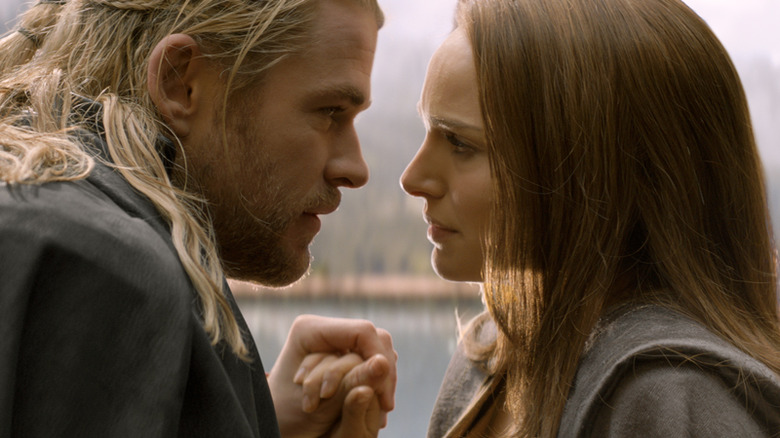 Chris Hemsworth as Thor and Natalie Portman as Jane Foster staring lovingly into each other's eyes in "Thor: The Dark World"