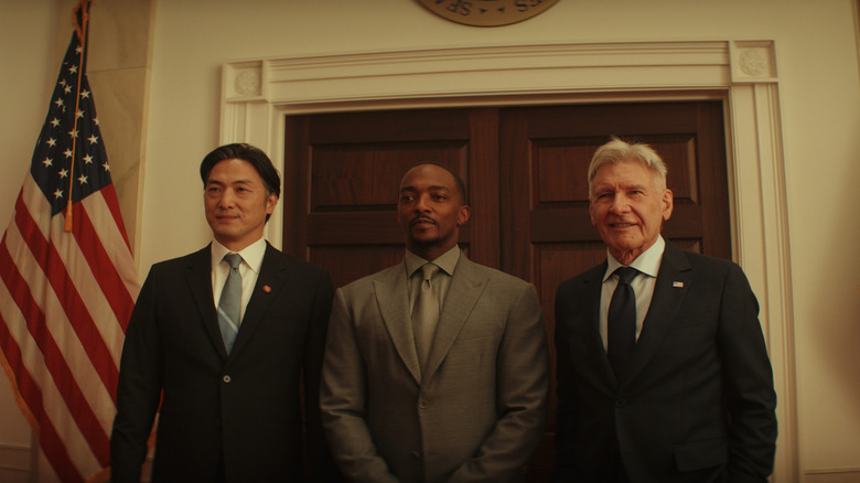 Takehiro Hira as Prime Minister Ozaki, Anthony Mackie as Sam Wilson, and Harrison Ford as Thaddeus Ross posing for a photograph at the White House in Captain America: Brave New World