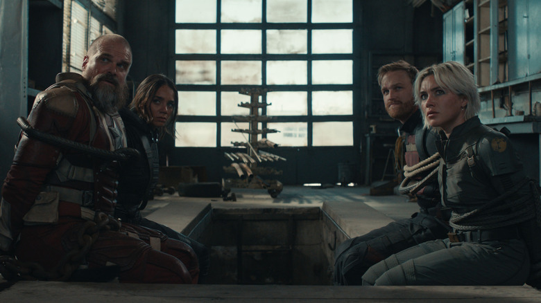 David Harbour as Red Guardian, Hannah John-Kamen as Ghost, Wyatt Russell as John Walker, and Florence Pugh as Yelena Belova all tied up in a room in Thunderbolts*