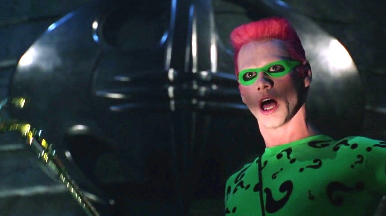 Jim Carrey as The Riddler with his cain in Batman Forever