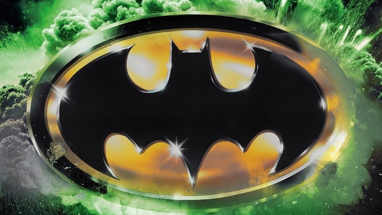 The Bat-symbol surrounded by green on the cover of Batman Revolution