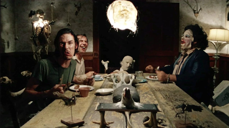 Edwin Neal, Jim Siedow, John Dugan, and Gunnar Hansen sit around the dinner table in The Texas Chain Saw Massacre